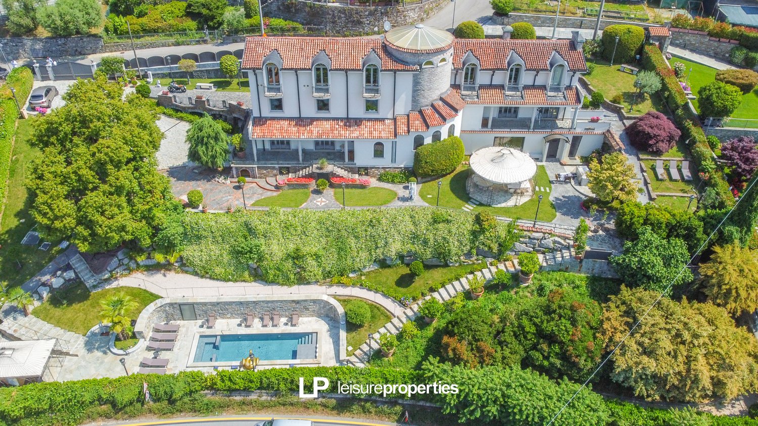 large villa, 2 story, red roof, white walls, pool, terrace, garden, car park, gazebo