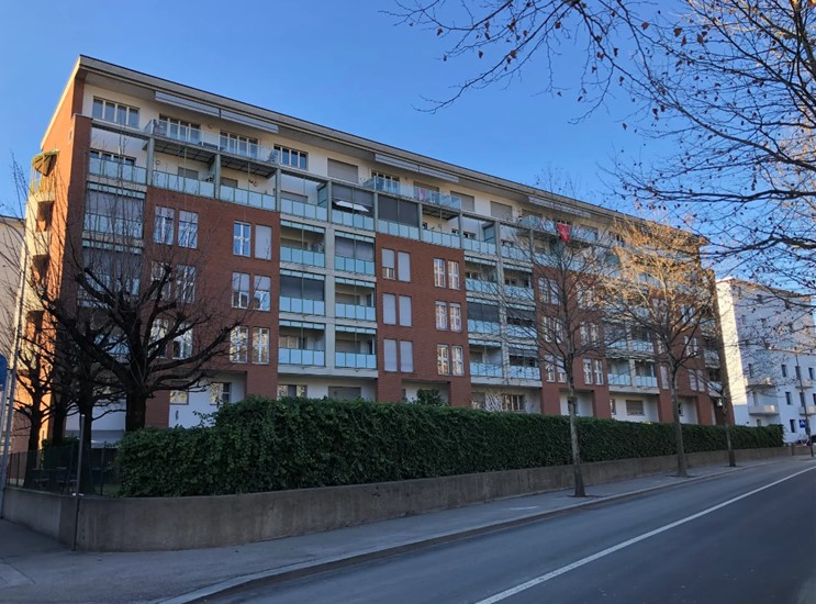 Residential apartment building with multiple floors and balconies