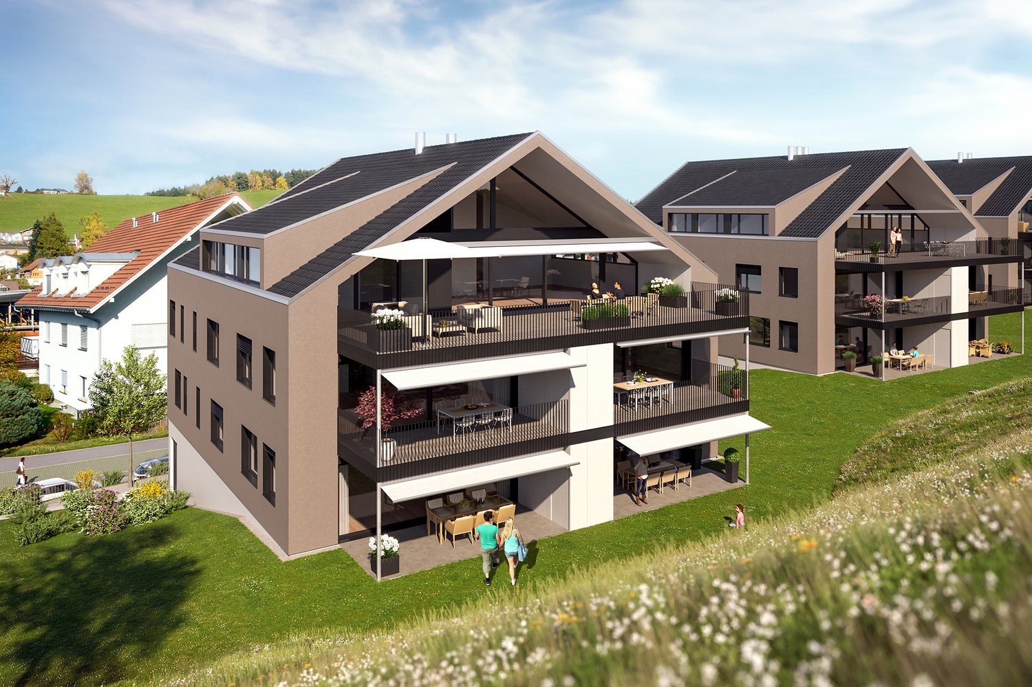 Aerial view of an apartment complex with multiple balconies, modern architecture, and a spacious garden. The balconies are equipped with outdoor furniture and shade awnings.