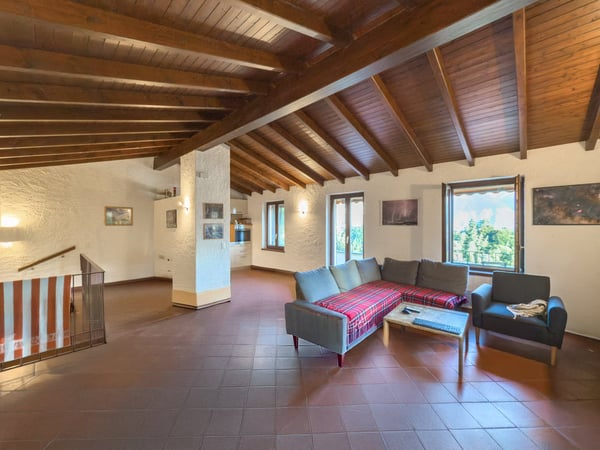 Casa 1.5 locali con giardino a Porza 1