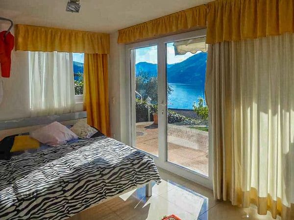 Villa a schiera con splendida vista lago a Bissone 7