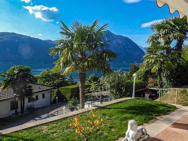 Villa a schiera con splendida vista lago a Bissone 8