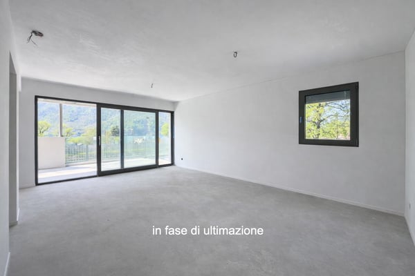 Moderno e nuovo 3.5 locali duplex con giardino a Melano 1