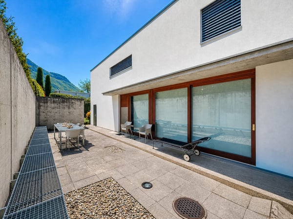 Casa contigua con giardino a Villa Luganese 8