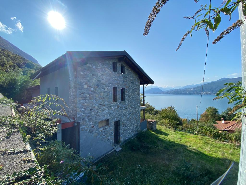 2 story stone house with lake view, balcony, small garden