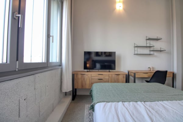 Coliving Moderne Alliant Intimité, Travail et Vie Partagée à Renens 7