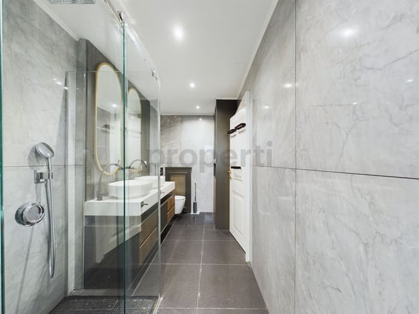 Moderne 1.5 Zimmer-Wohnung mit grosszügiger Terrasse und Garten in Küsnacht 11