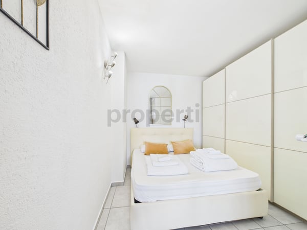 Appartamento 2.5 locali con vista lago e piscina condominiale - ideale come residenza primaria, secondaria o investimento per affitti brevi! 6
