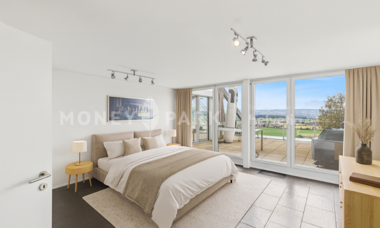 Appartamento a terrazza di 4,5 locali con vista panoramica eccezionale e serra