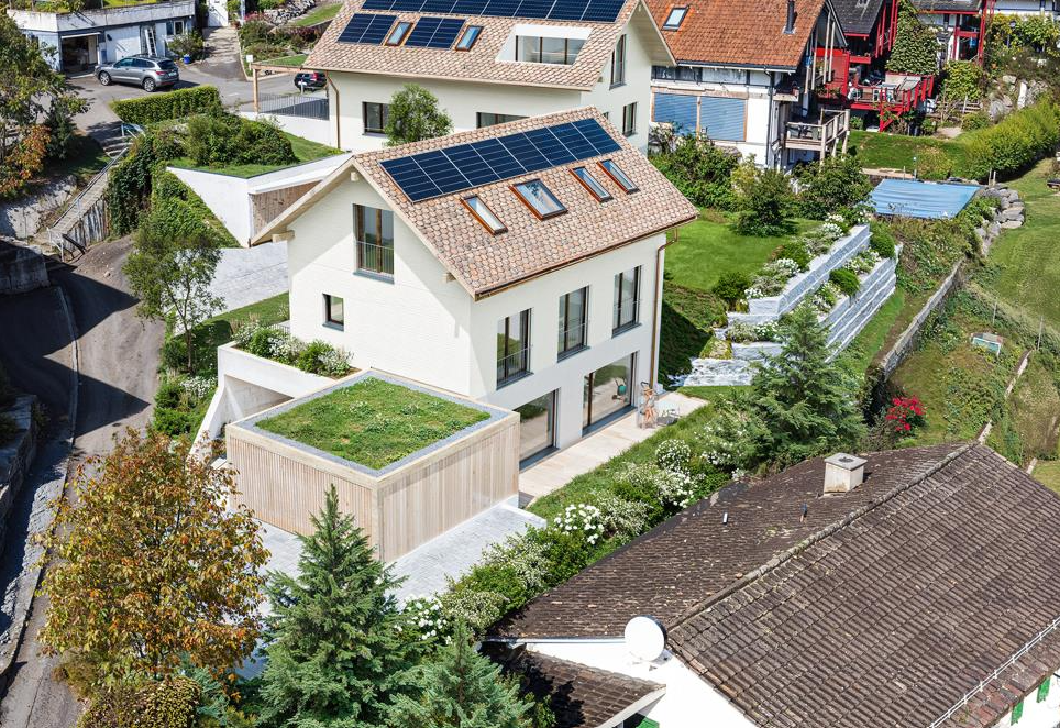 2 story house, tiled roof, solar panels, raised ground floor, terrace, green roof, swimming pool