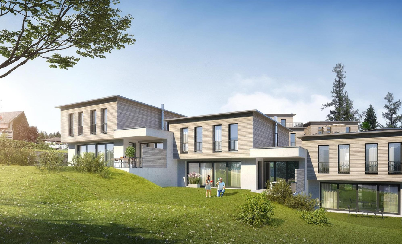 Modern architectural design with a combination of glass and wooden facades, set on a sloped terrain with lush greenery.